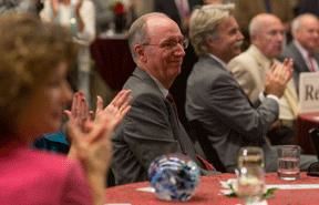 Charles R. Bantz smiling at a reception.